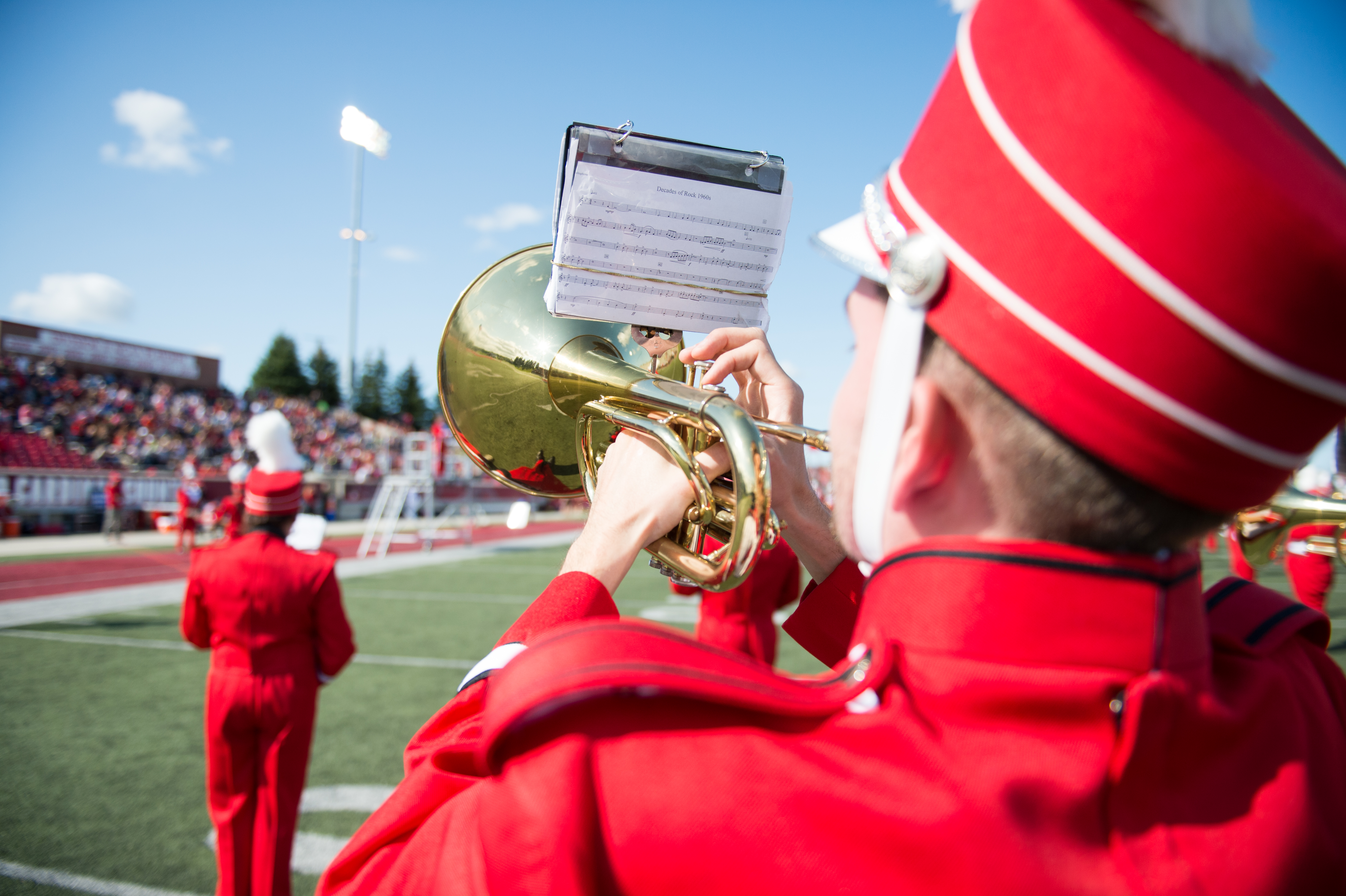 Marching band performing on the football field